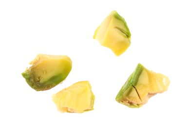 Pieces of peeled pistachio nut isolated on white