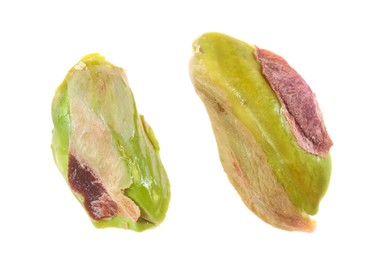 Photo of Pieces of peeled pistachio nut isolated on white