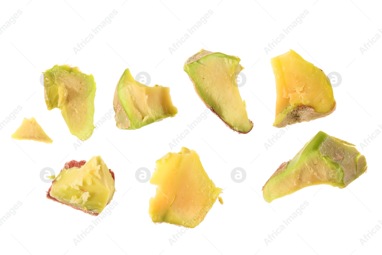 Photo of Pieces of peeled pistachio nut isolated on white