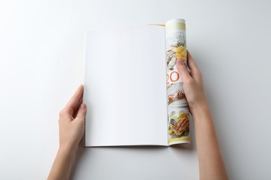 Woman reading magazine on white background, closeup. Mockup for design