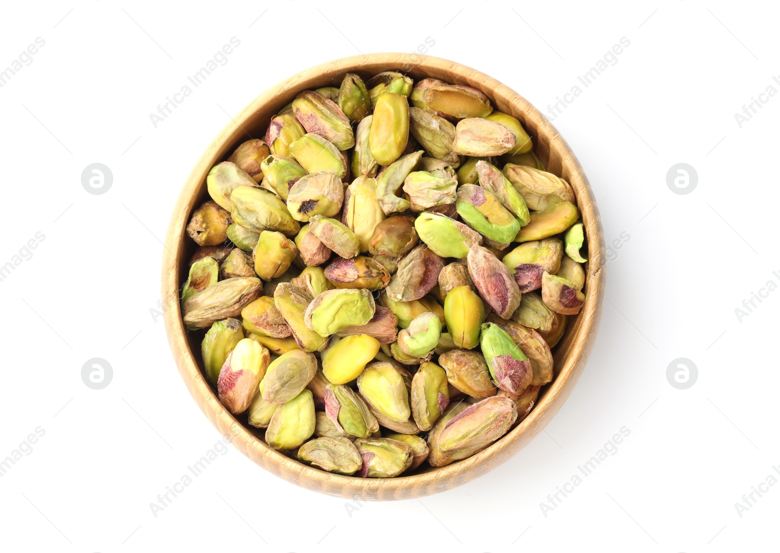 Photo of Peeled pistachio nuts in bowl isolated on white, top view