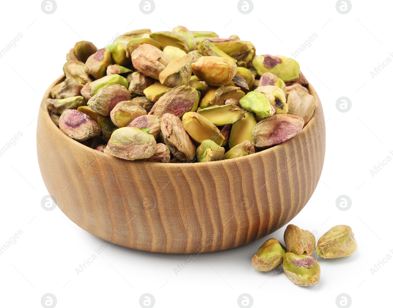 Photo of Peeled pistachio nuts in bowl isolated on white