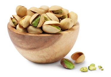 Photo of Tasty pistachio nuts in bowl isolated on white