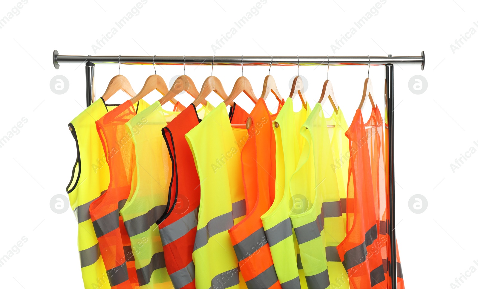 Photo of Different bright reflective vests on clothing rack isolated on white