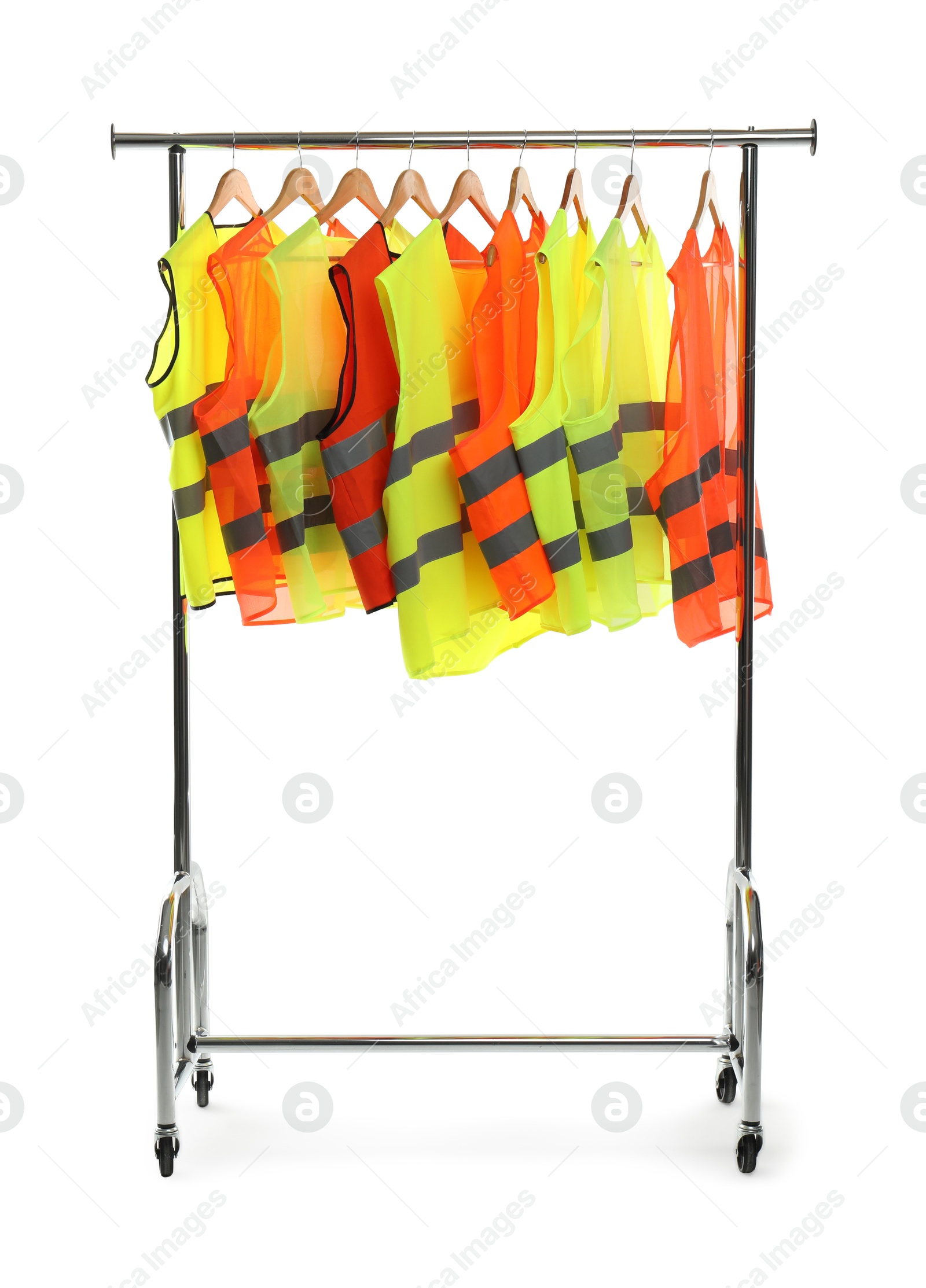 Photo of Different bright reflective vests on clothing rack isolated on white