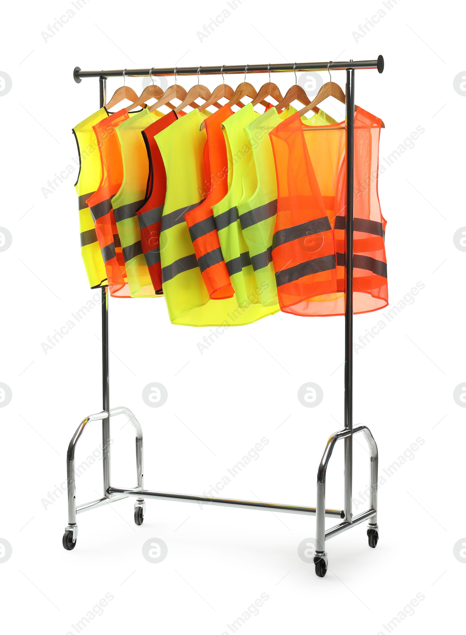 Photo of Different bright reflective vests on clothing rack isolated on white