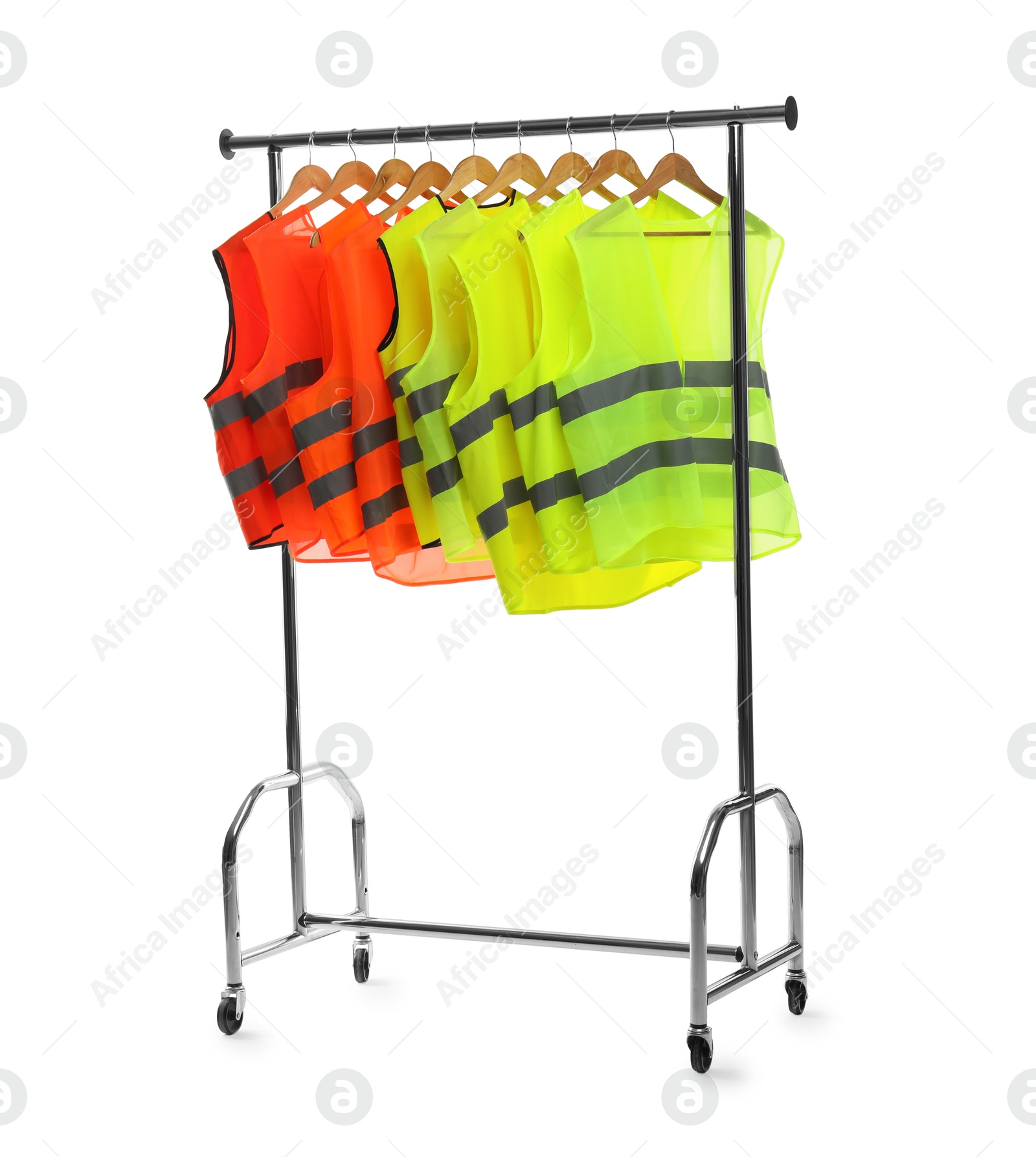 Photo of Different bright reflective vests on clothing rack isolated on white