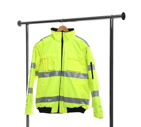 Photo of Bright policeman's jacket on clothing rack isolated on white