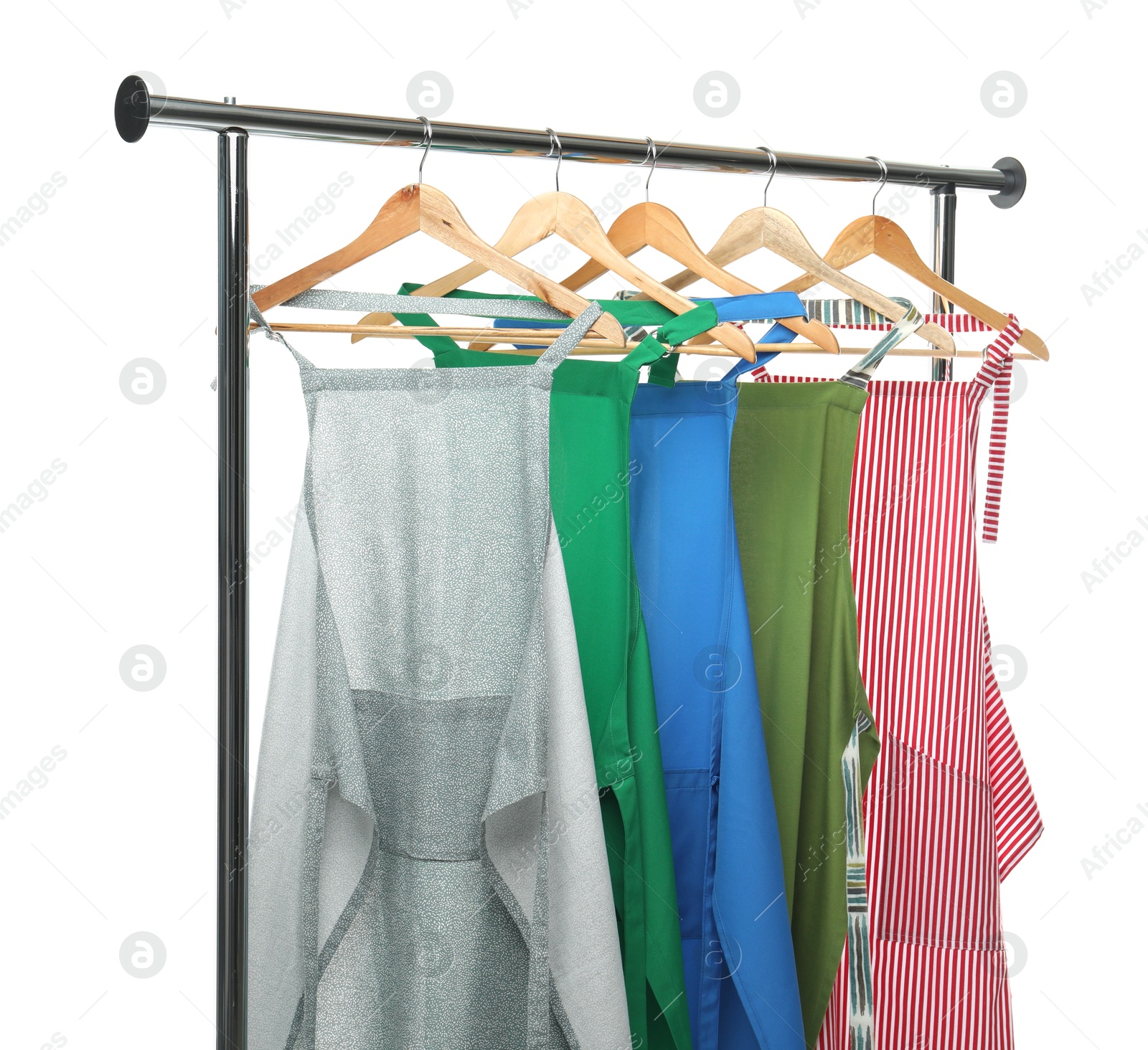 Photo of Chef's aprons on clothing rack isolated on white