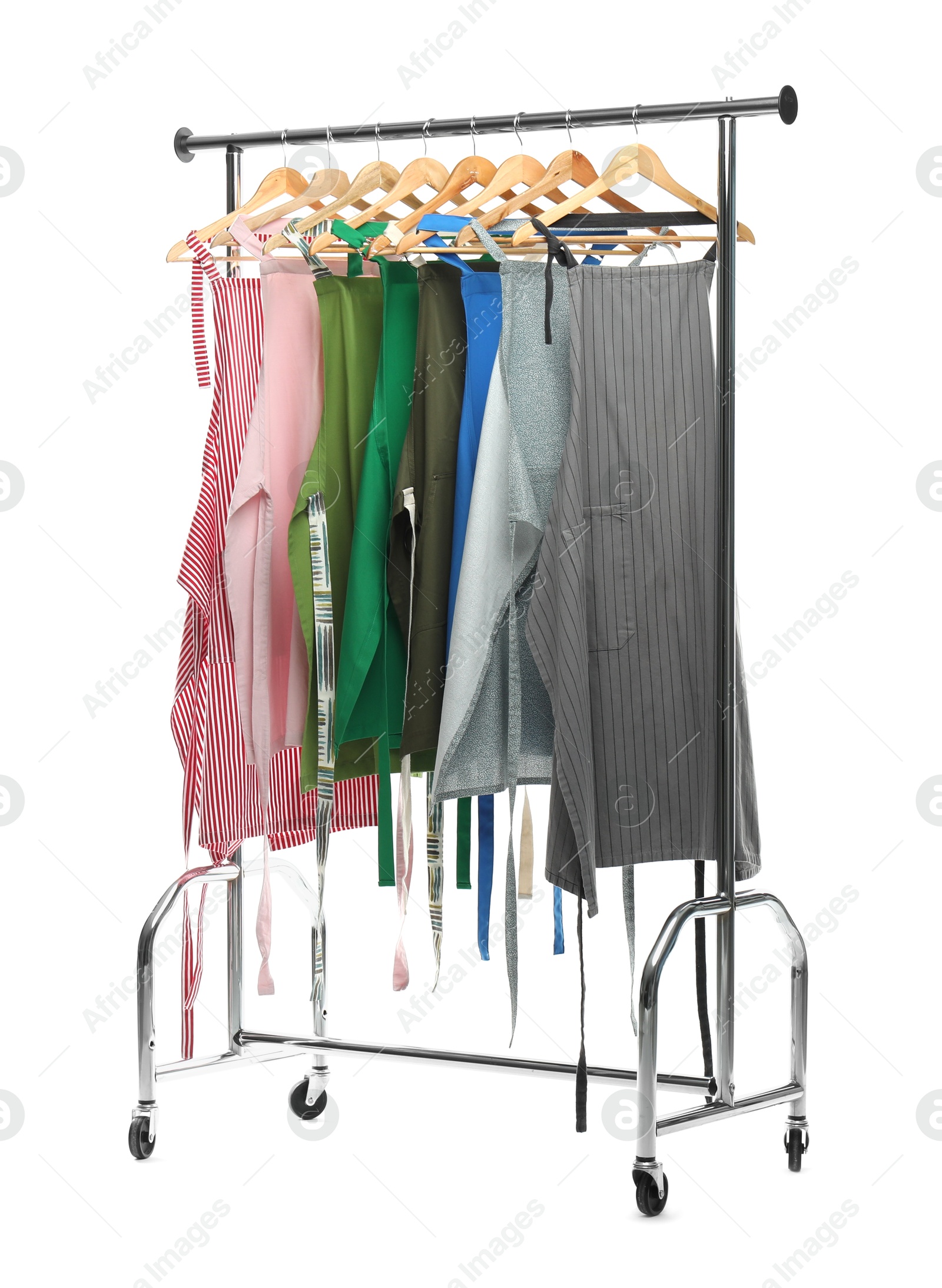 Photo of Chef's aprons on clothing rack isolated on white