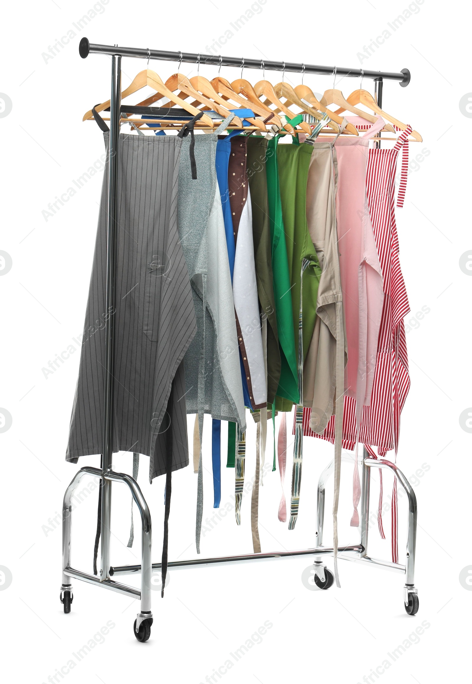 Photo of Chef's aprons on clothing rack isolated on white