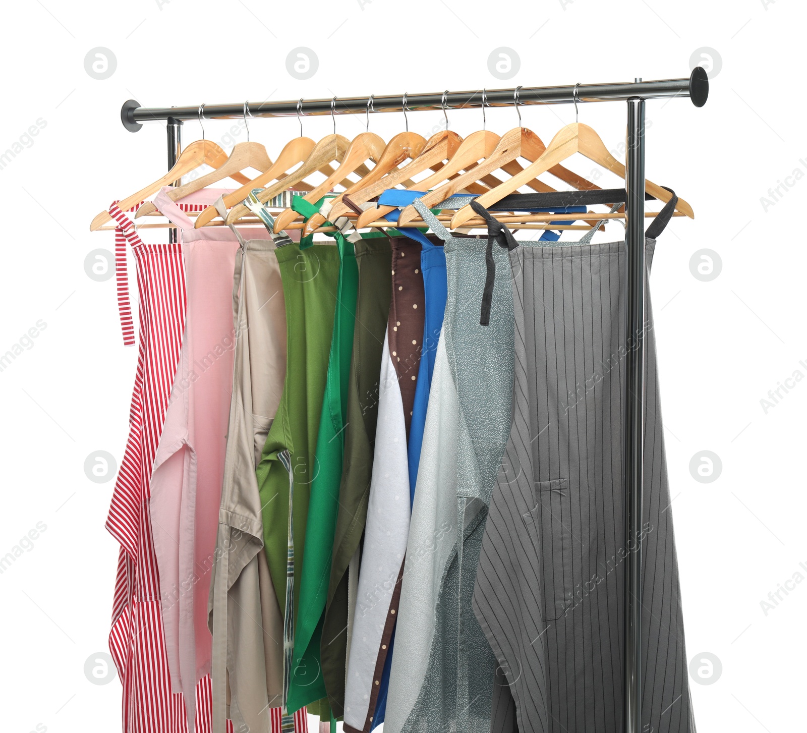 Photo of Chef's aprons on clothing rack isolated on white