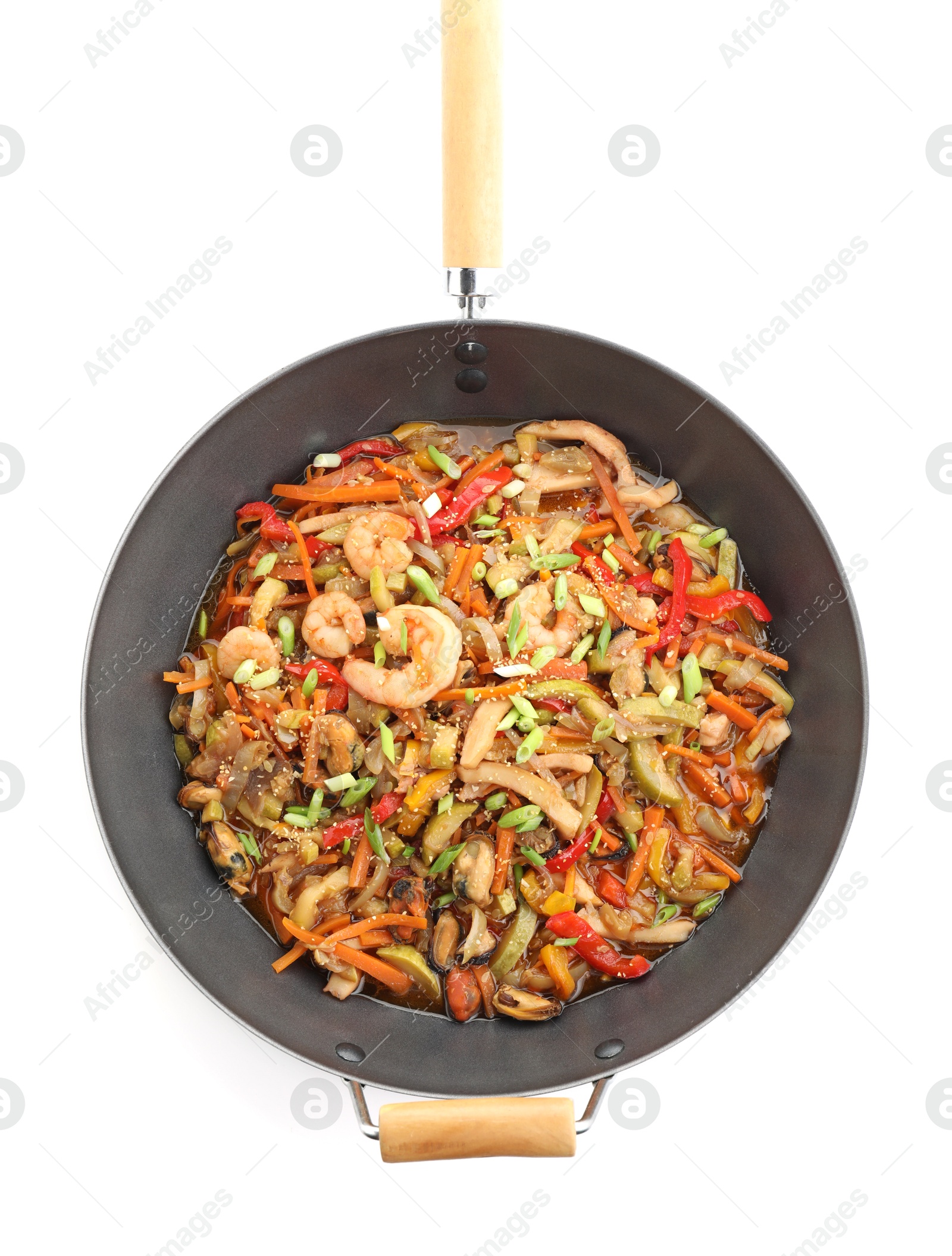 Photo of Stir-fry sea food in wok isolated on white, top view