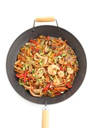 Photo of Stir-fry sea food in wok isolated on white, top view