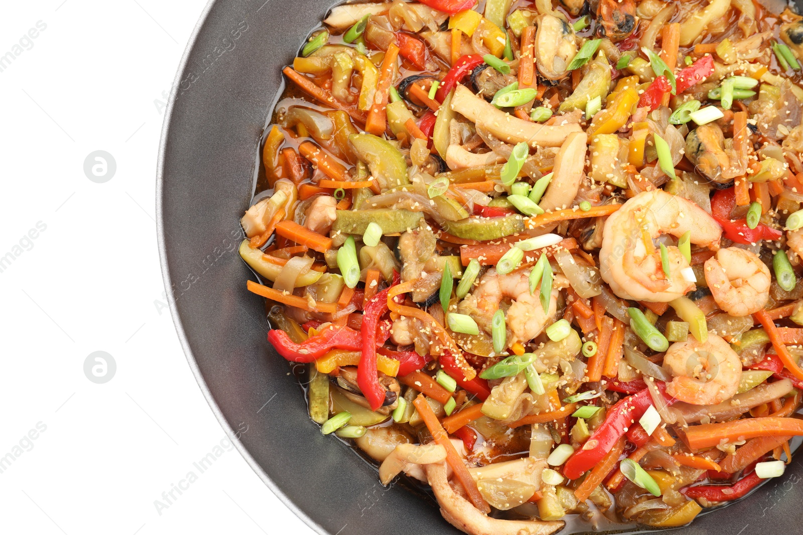 Photo of Stir-fry sea food in wok isolated on white, top view