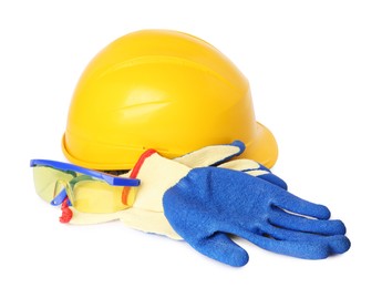 Photo of Yellow hard hat, goggles and gloves isolated on white. Safety equipment