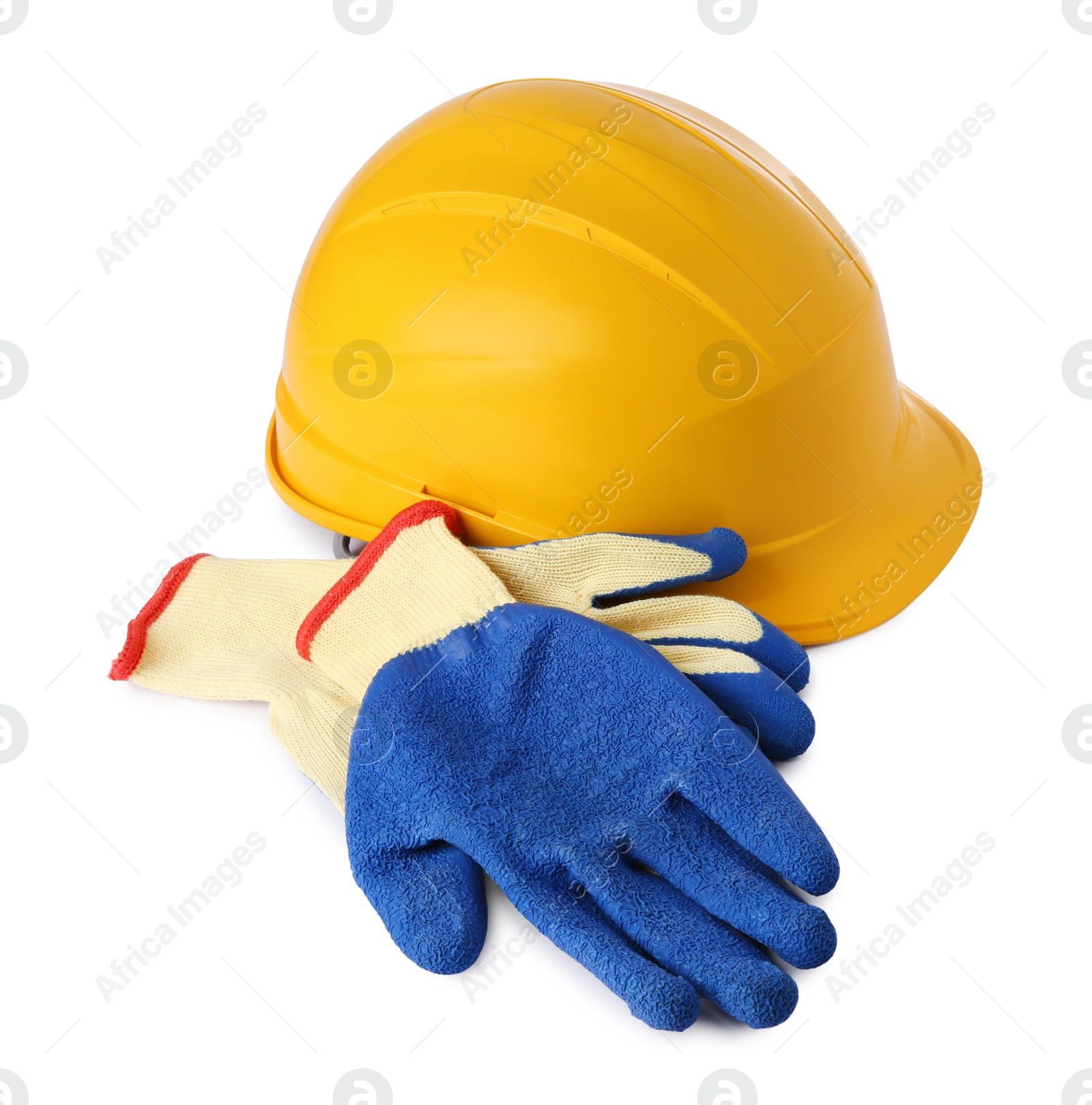 Photo of Yellow hard hat and gloves isolated on white. Safety equipment