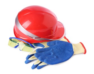 Photo of Orange hard hat, goggles and gloves isolated on white. Safety equipment