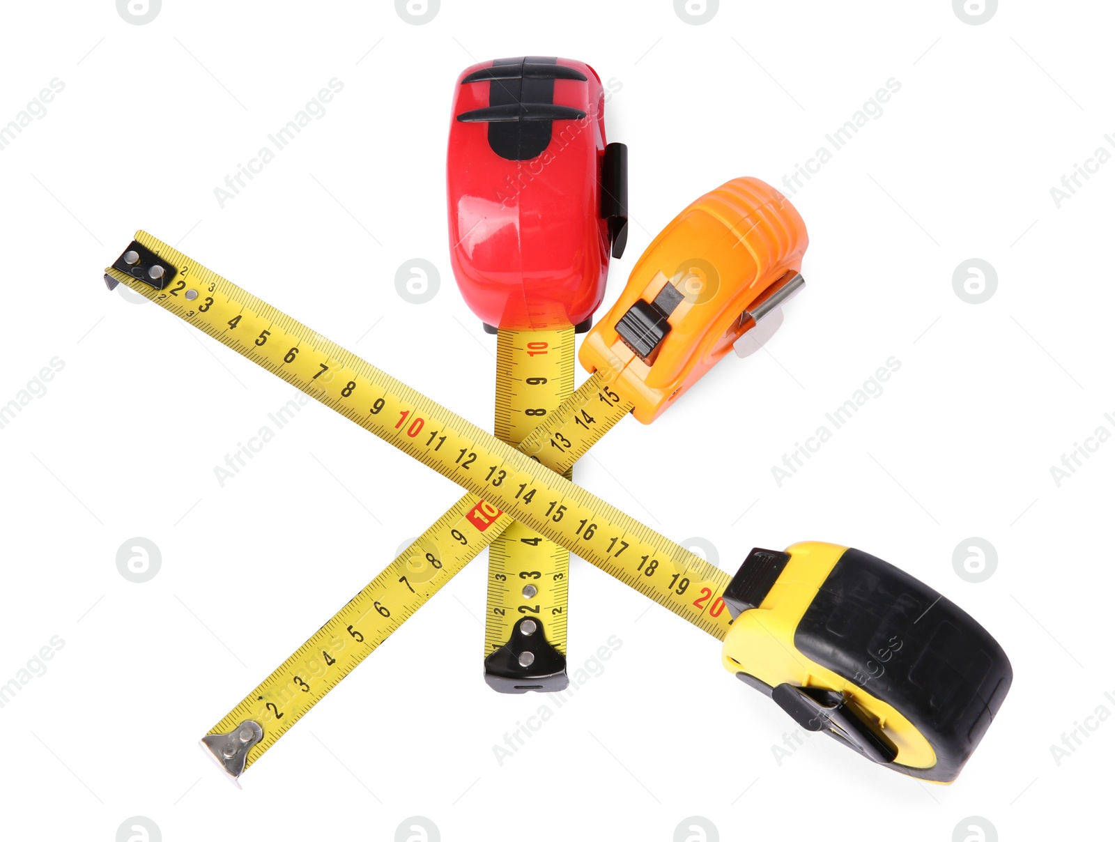 Photo of Different measuring tapes isolated on white. Construction tool