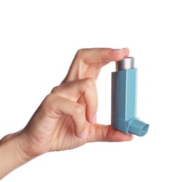 Woman holding asthma inhaler on white background, closeup