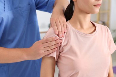 Physiotherapist working with patient in rehabilitation center, closeup