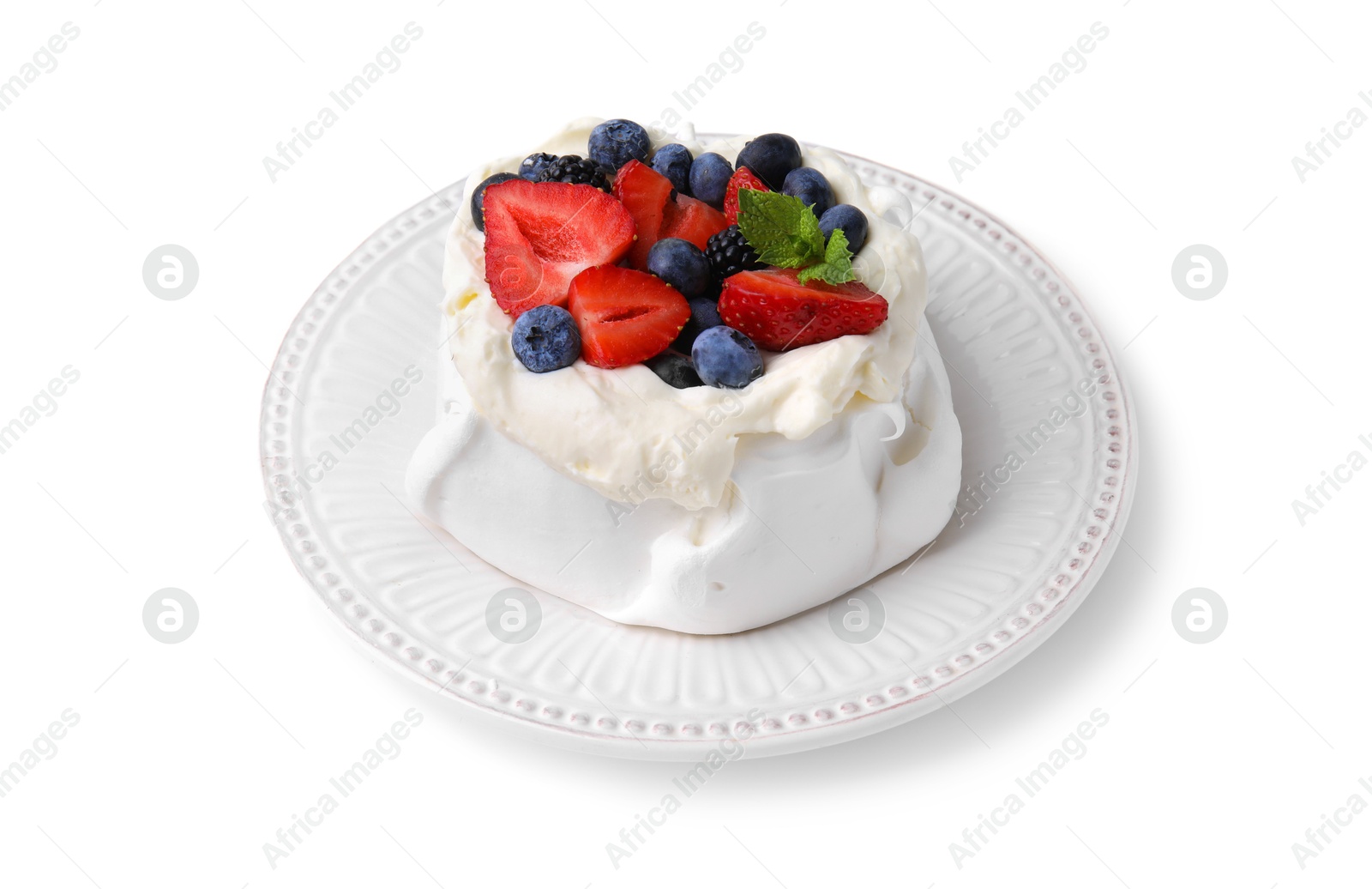 Photo of Pavlova cake (meringue dessert) with whipped cream, fresh berries and mint isolated on white