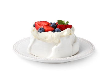 Photo of Pavlova cake (meringue dessert) with whipped cream, fresh berries and mint isolated on white