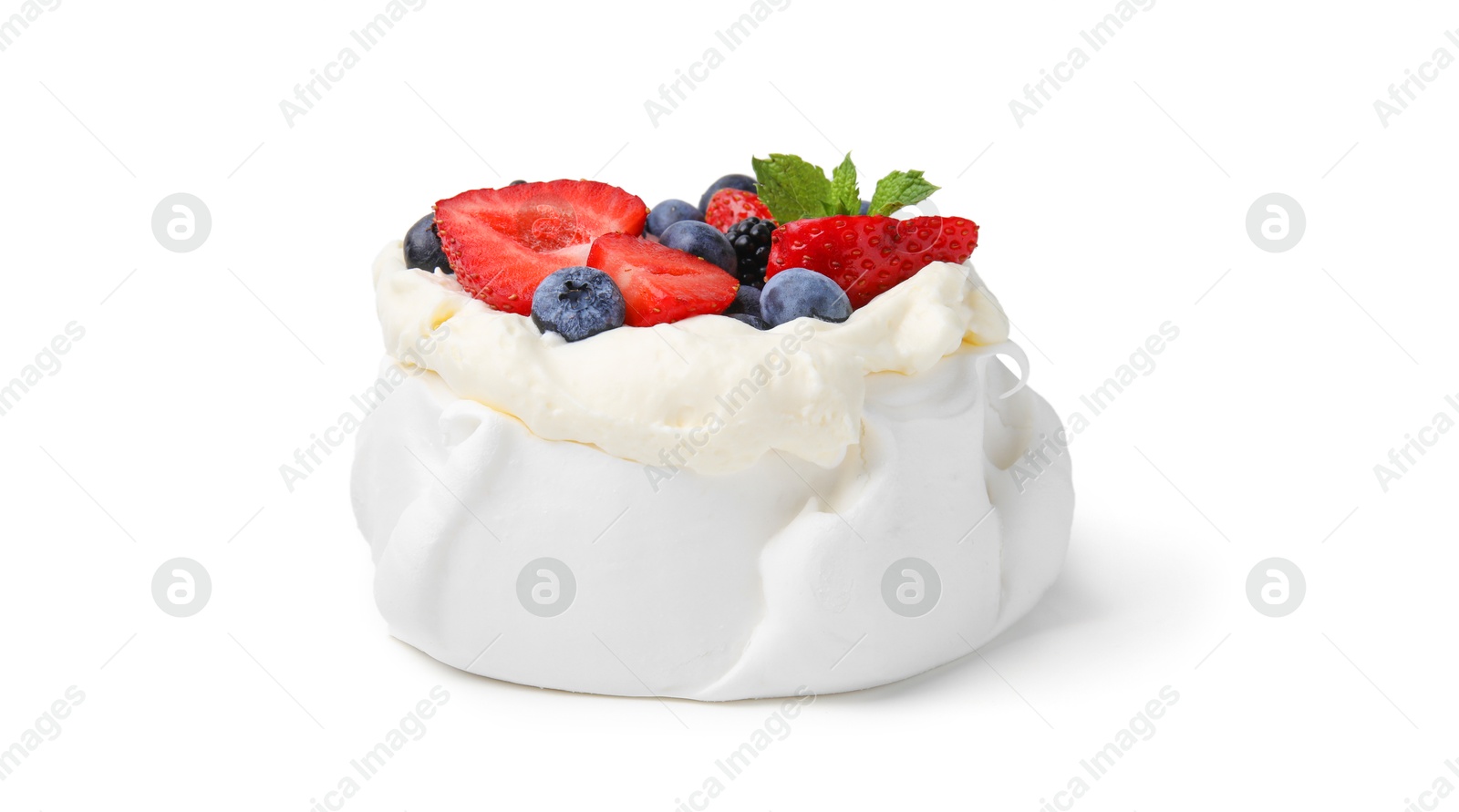 Photo of Pavlova cake (meringue dessert) with whipped cream, fresh berries and mint isolated on white