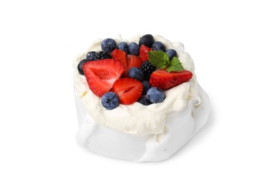 Photo of Pavlova cake (meringue dessert) with whipped cream, fresh berries and mint isolated on white