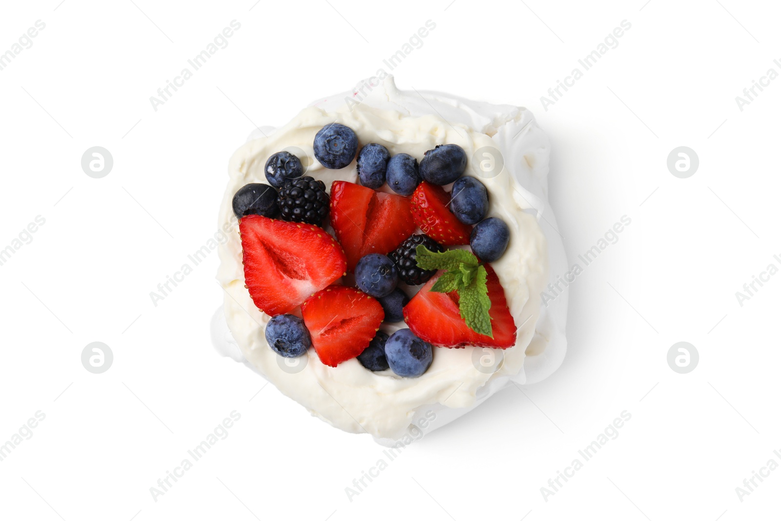 Photo of Pavlova cake (meringue dessert) with whipped cream, fresh berries and mint isolated on white, top view