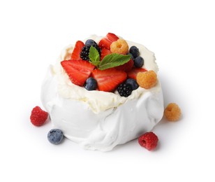 Photo of Pavlova cake (meringue dessert) with whipped cream, fresh berries and mint isolated on white