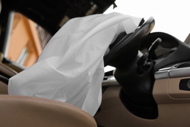 Opened airbag in automobile, closeup. Car safety equipment