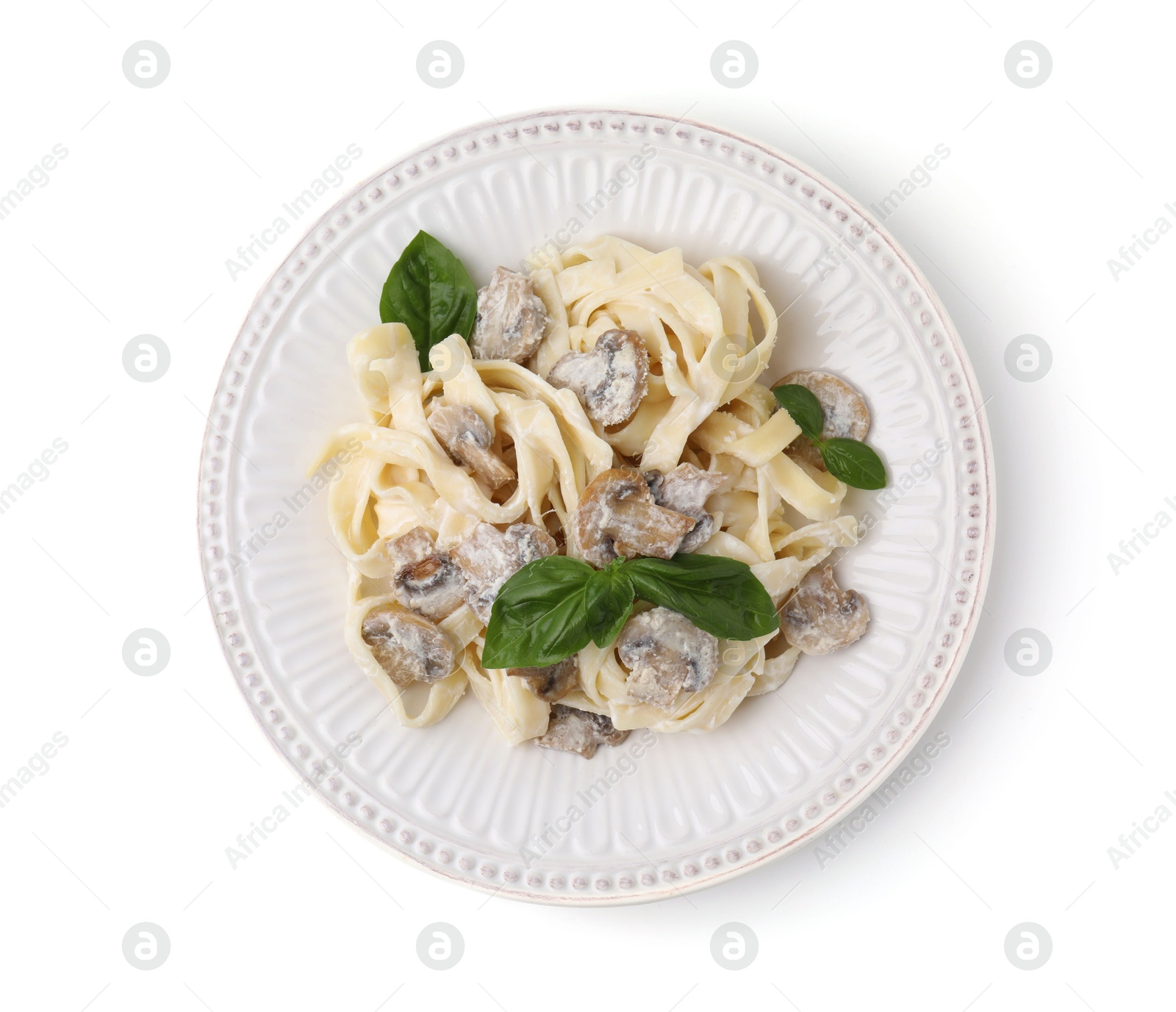 Photo of Delicious pasta with mushrooms and basil isolated on white, top view