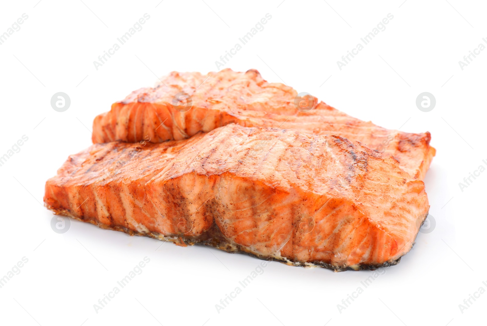 Photo of Delicious grilled salmon fillets isolated on white