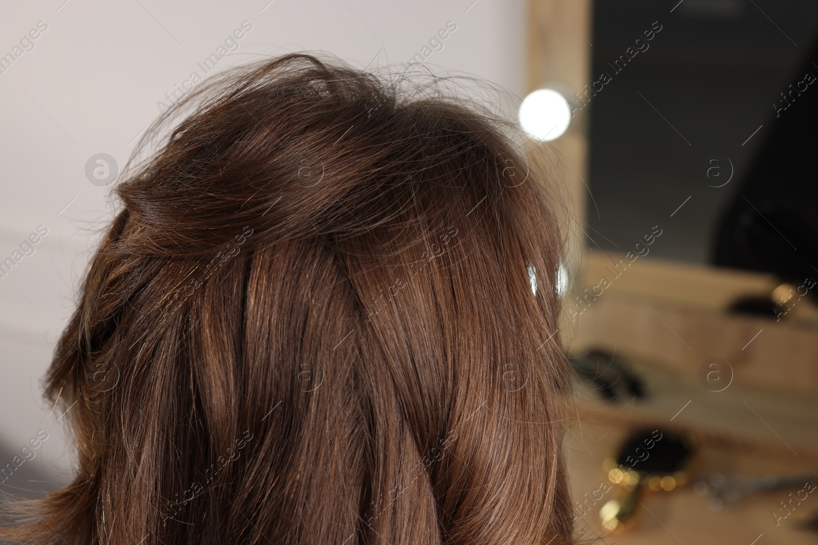 Photo of Woman with stylish haircut in salon, closeup