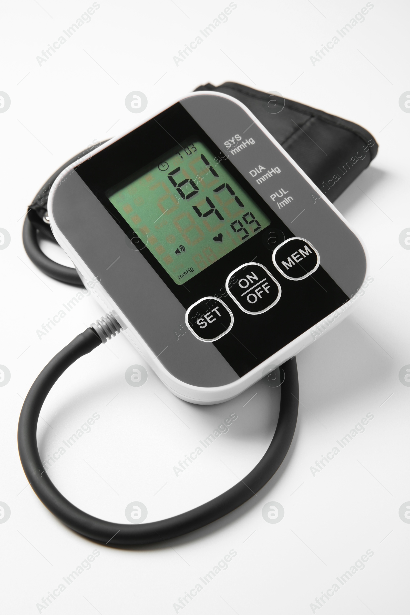 Photo of Blood pressure measuring device on light grey background