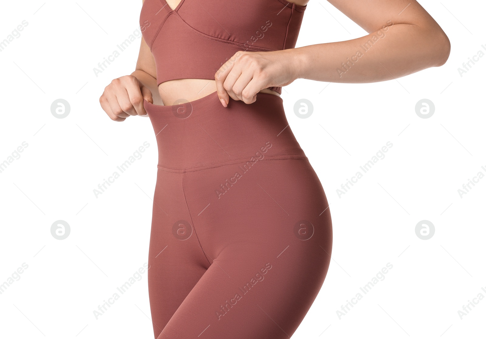 Photo of Woman wearing sports leggings and bra on white background, closeup