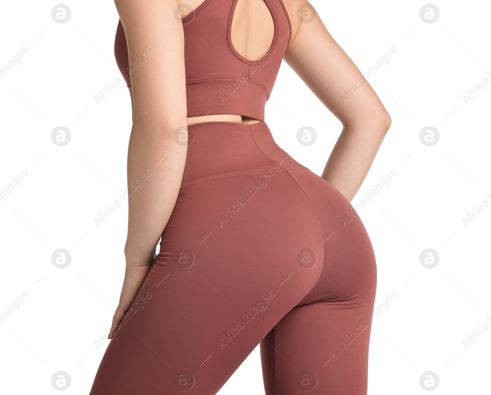 Photo of Woman wearing sports leggings and bra on white background, closeup