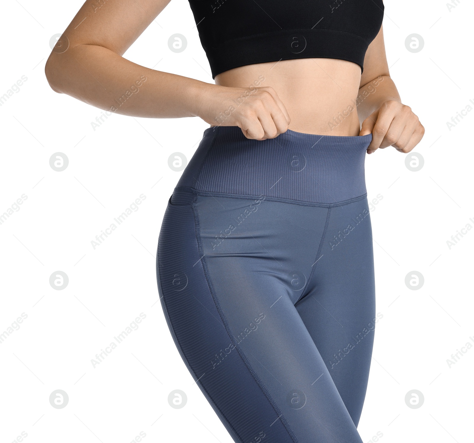 Photo of Woman wearing sports leggings on white background, closeup