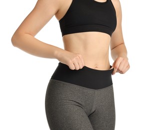 Photo of Woman wearing sports leggings and bra on white background, closeup