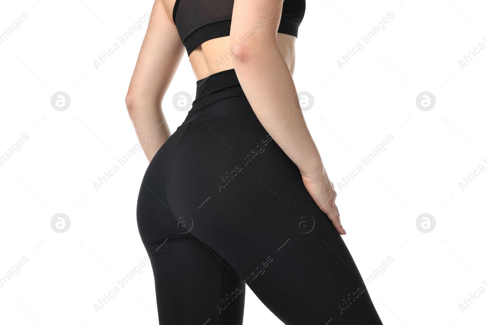 Photo of Woman wearing black sports leggings on white background, closeup