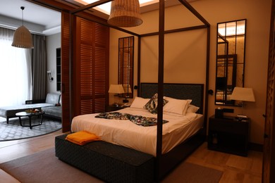 Comfortable large bed in stylish hotel room