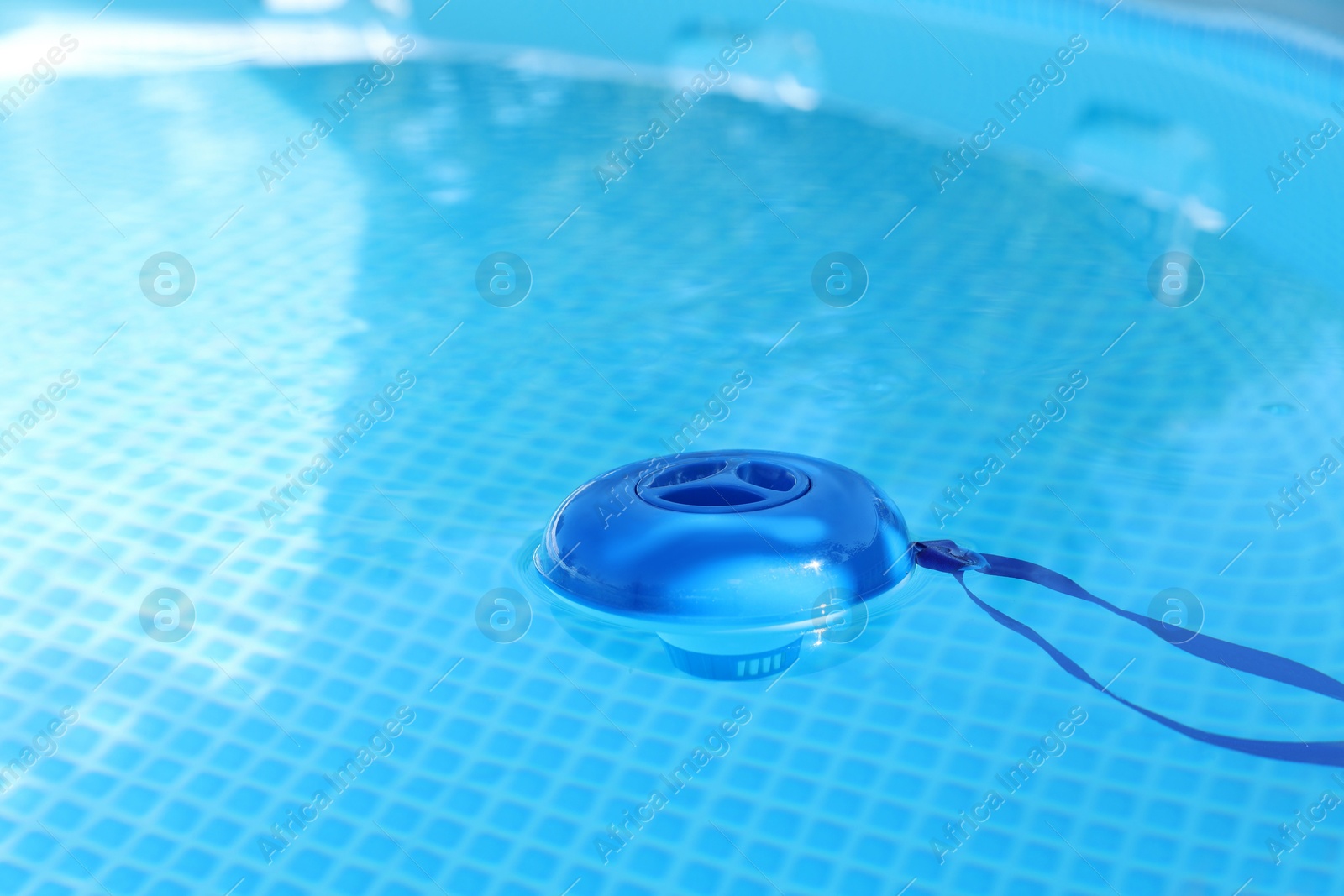 Photo of One robotic cleaner in swimming pool outdoors