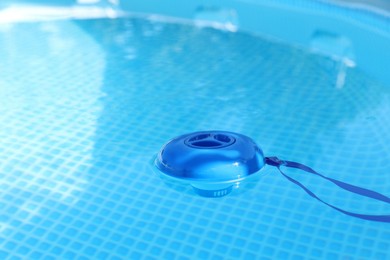 Photo of One robotic cleaner in swimming pool outdoors