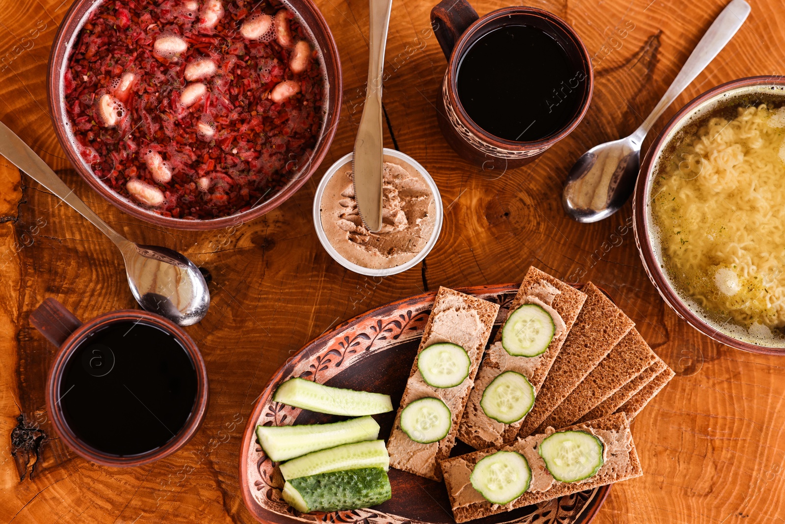 Photo of Different dishes of Ukrainian cuisine on wooden table in cafe, flat lay