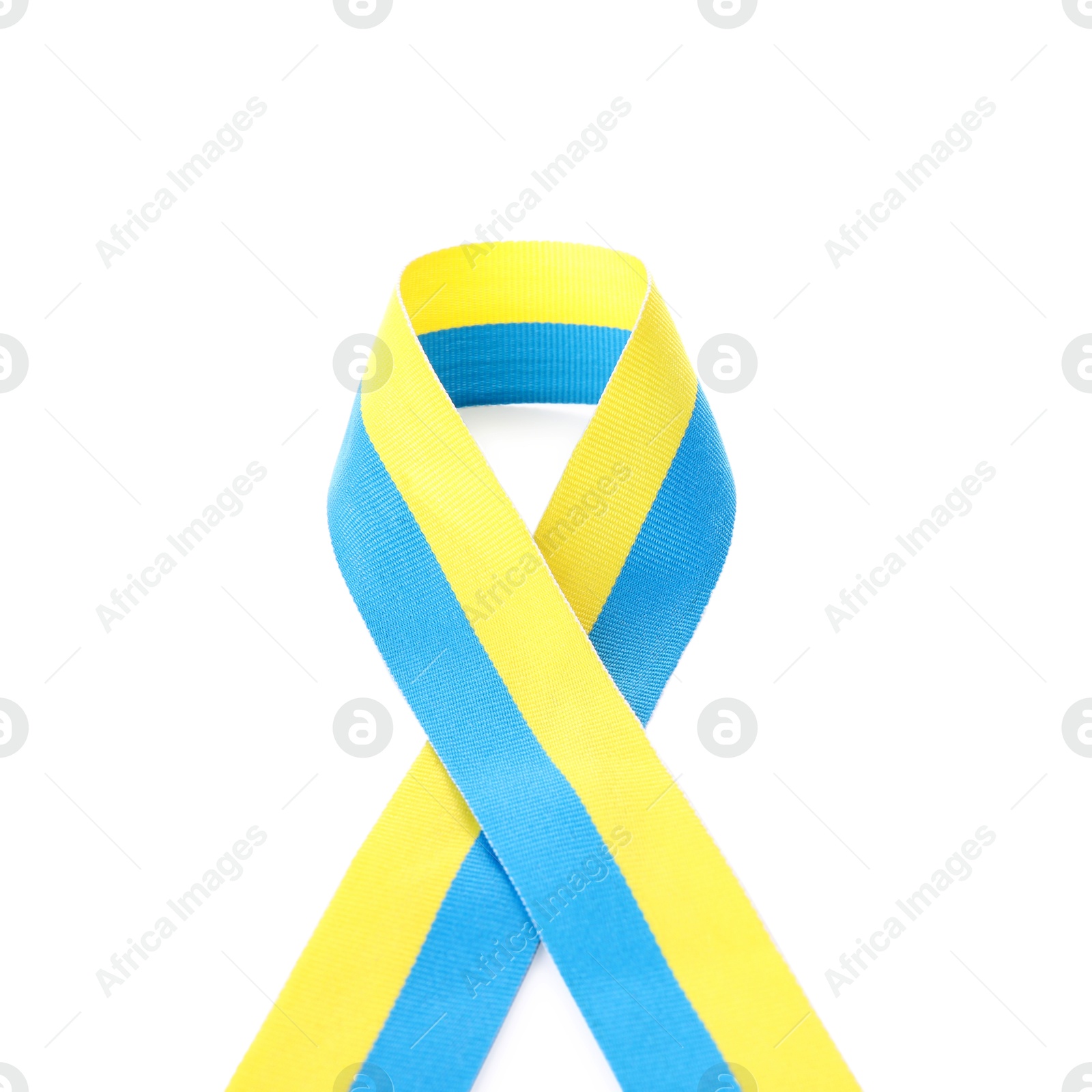 Photo of Ribbon in colors of Ukrainian national flag isolated on white, top view