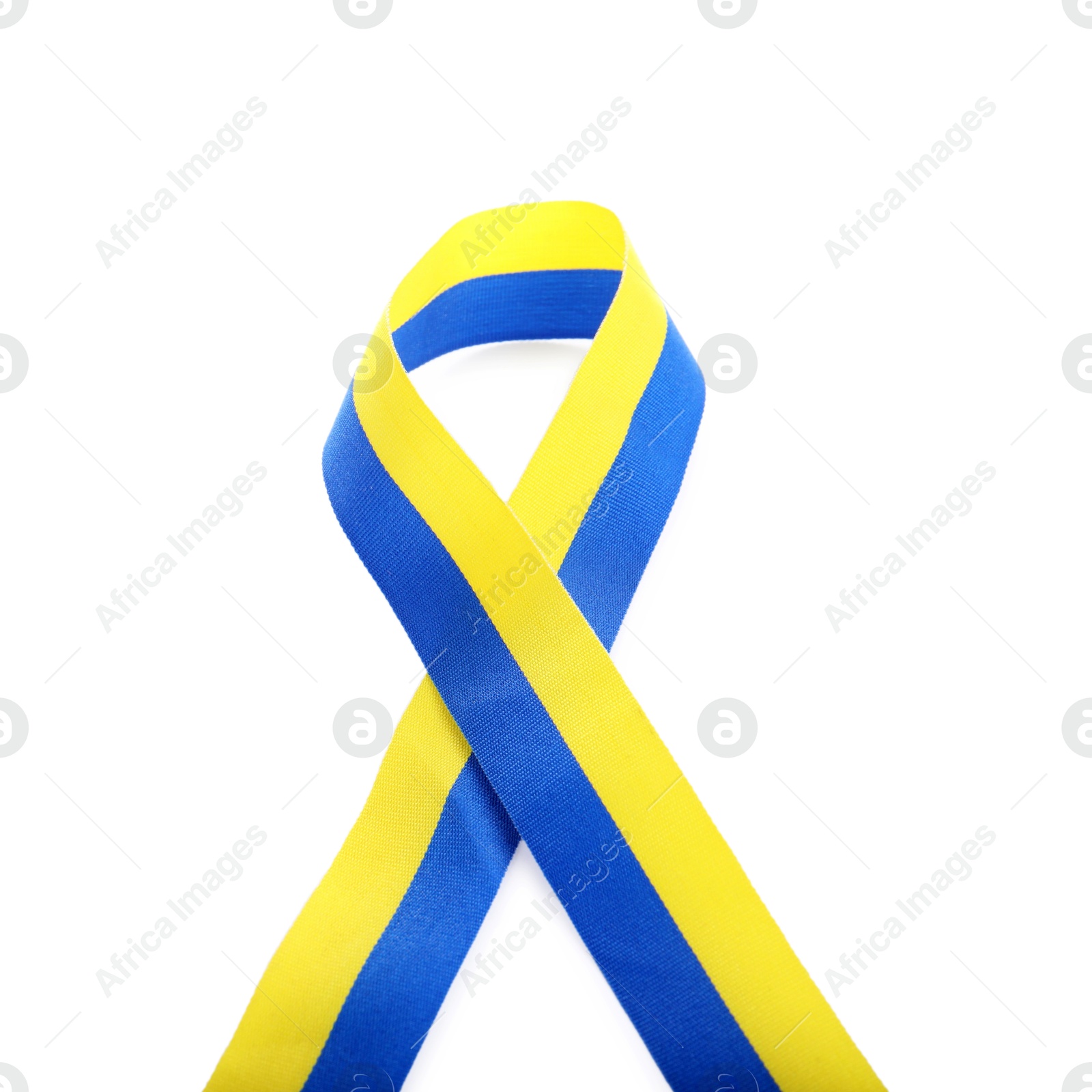 Photo of Ribbon in colors of Ukrainian national flag isolated on white, top view