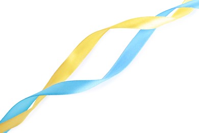 Photo of Ribbons in colors of Ukrainian national flag isolated on white, top view