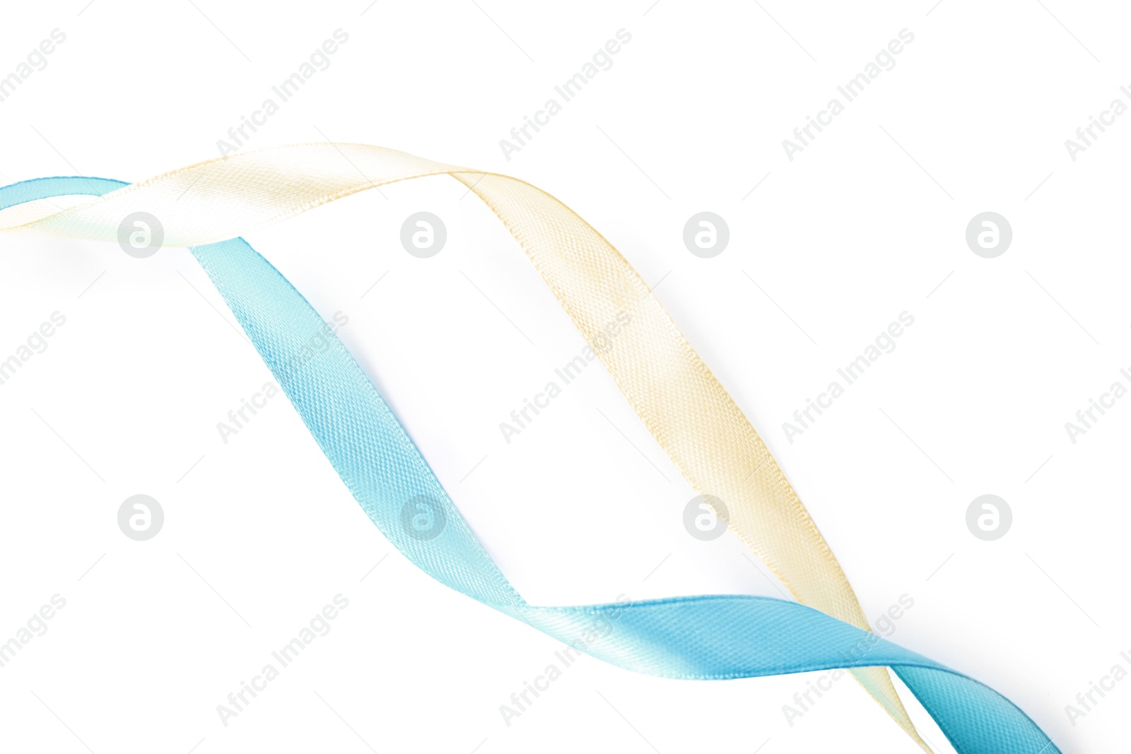 Photo of Ribbons in colors of Ukrainian national flag isolated on white, top view