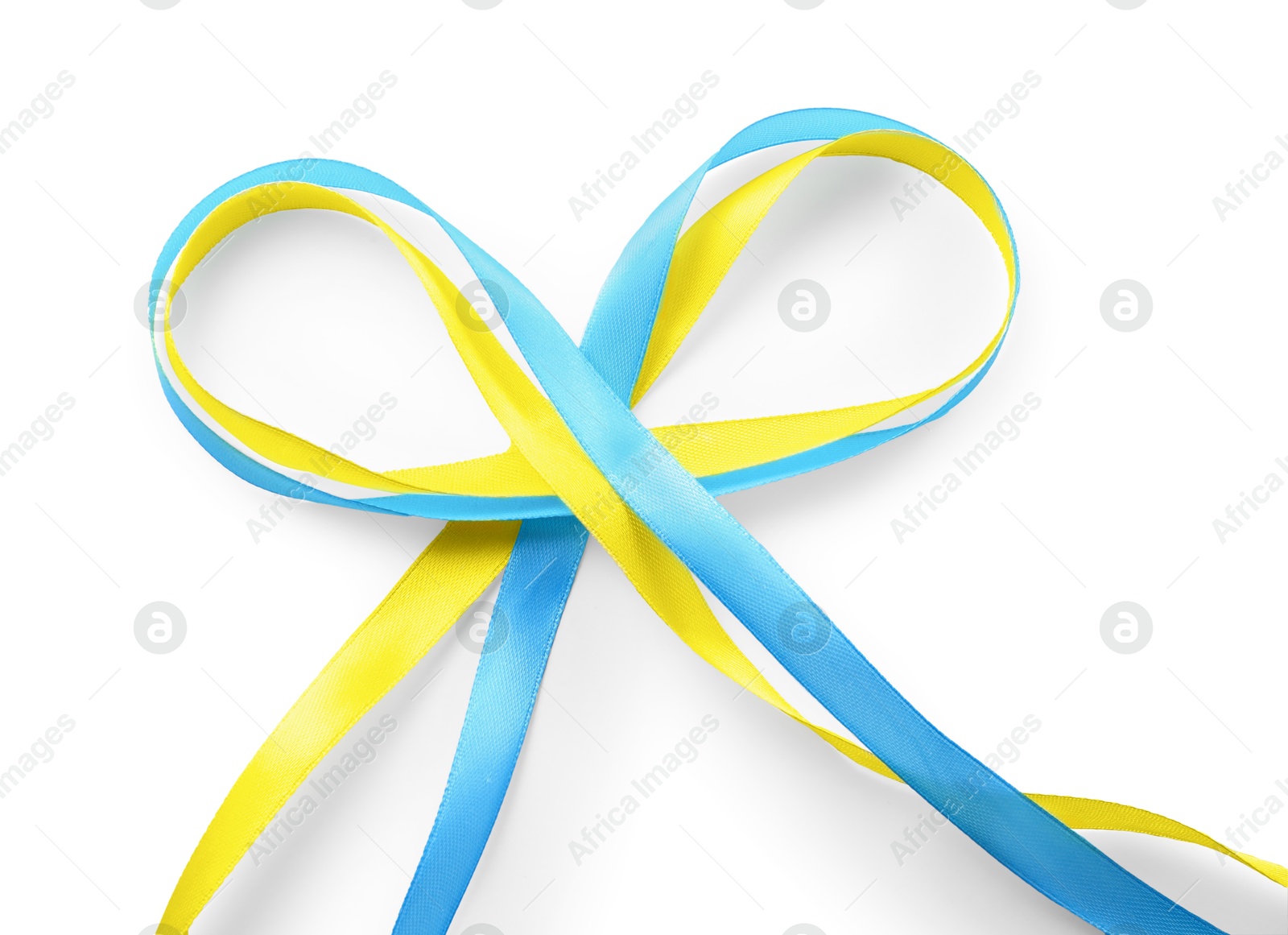 Photo of Ribbons in colors of Ukrainian national flag isolated on white, top view